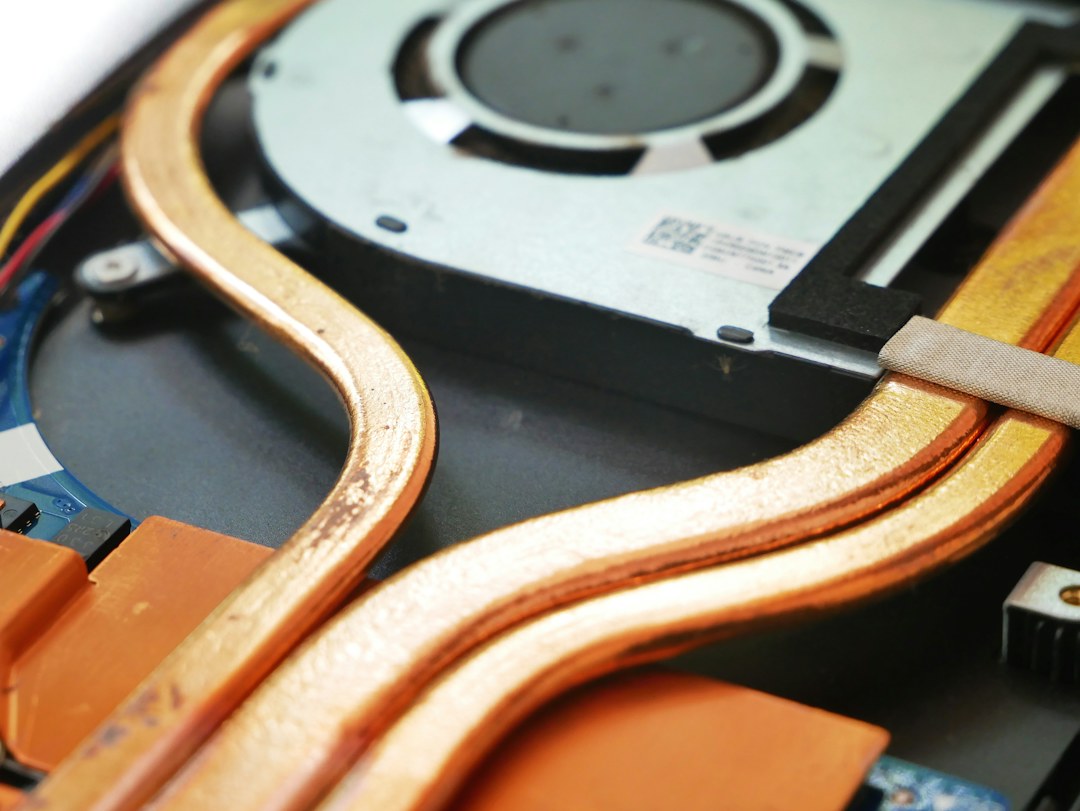Laptop cooling assembly with heat pipes; topic photograph by Vishnu Mohanan
